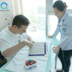 Zdenek enjoying hand function training in one of his occupational therapy sessions